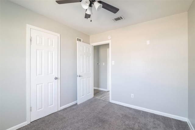 unfurnished bedroom with carpet floors and ceiling fan