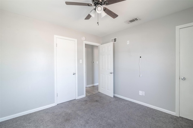 unfurnished bedroom with ceiling fan and carpet