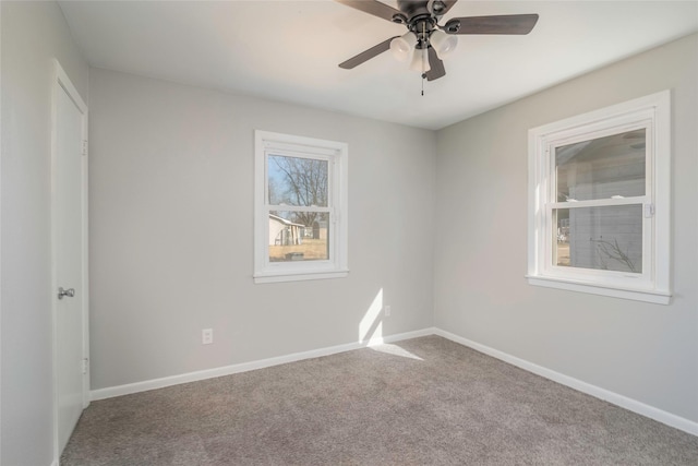 unfurnished room with carpet flooring and ceiling fan