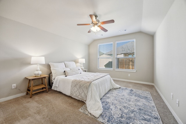 carpeted bedroom featuring vaulted ceiling and ceiling fan