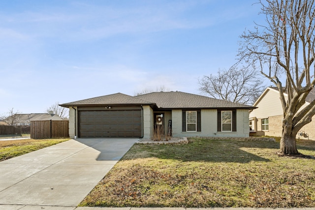 view of front of house with a garage and a front lawn