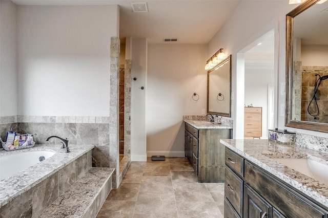 bathroom featuring vanity and shower with separate bathtub