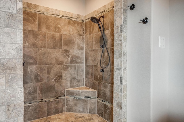 bathroom with tiled shower