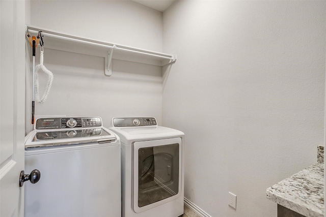 laundry room with separate washer and dryer