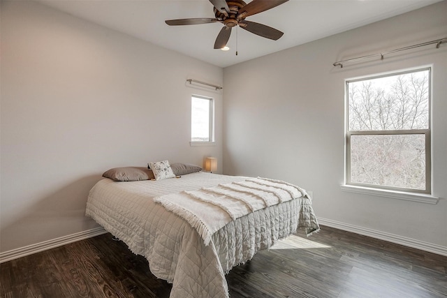 bedroom featuring dark wood-type flooring and ceiling fan