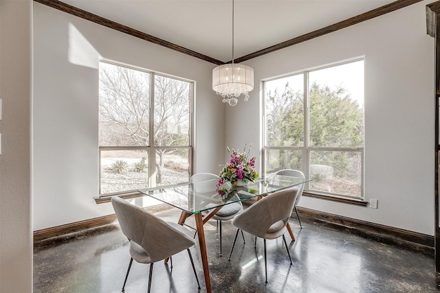 dining room featuring crown molding and a notable chandelier