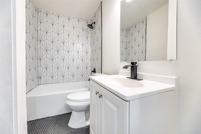 full bathroom featuring vanity, tile patterned flooring, tiled shower / bath combo, and toilet