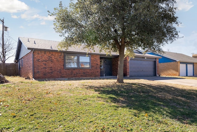 ranch-style home featuring a garage and a front lawn