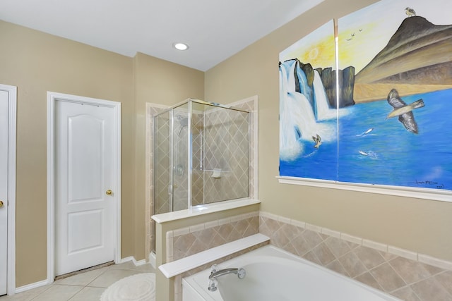 bathroom with independent shower and bath and tile patterned flooring