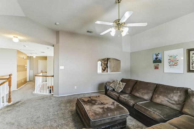 carpeted living room featuring ceiling fan and vaulted ceiling