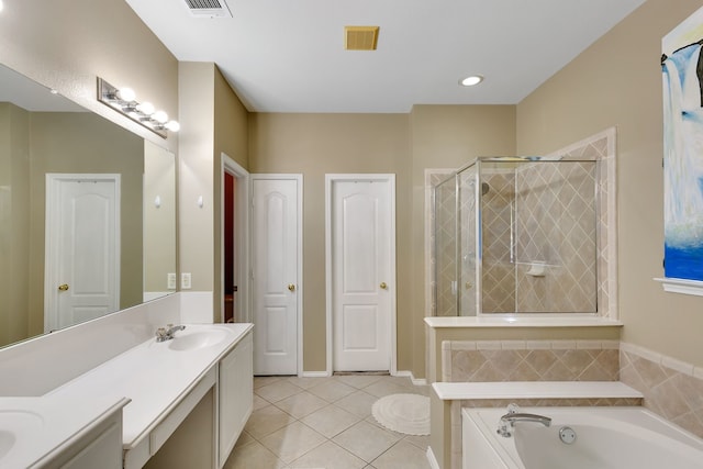 bathroom featuring vanity, tile patterned flooring, and separate shower and tub