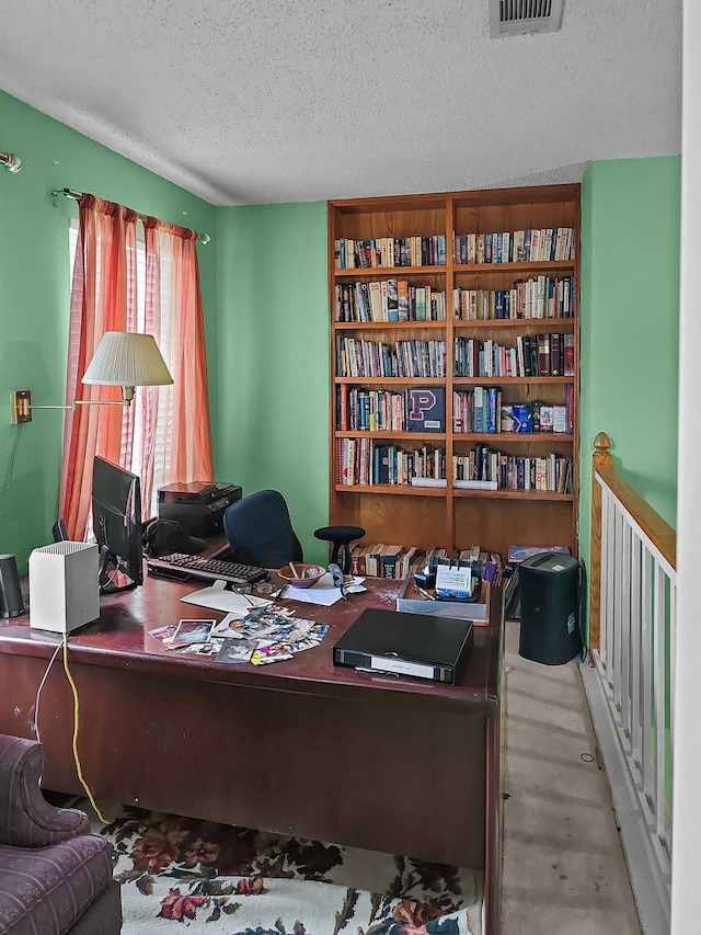 home office with a textured ceiling