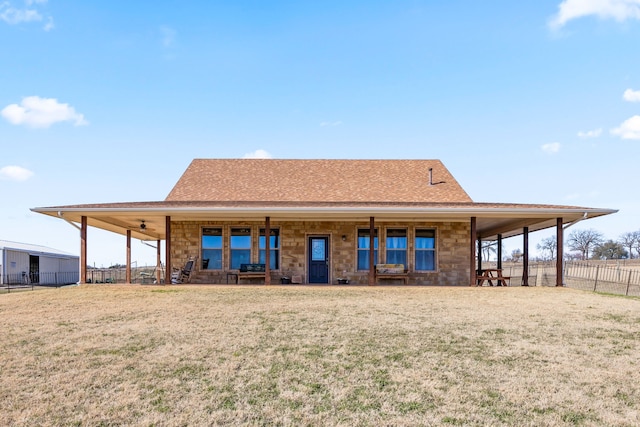 back of house featuring a yard