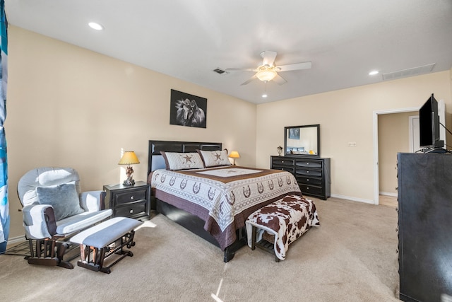 bedroom featuring ceiling fan and light carpet