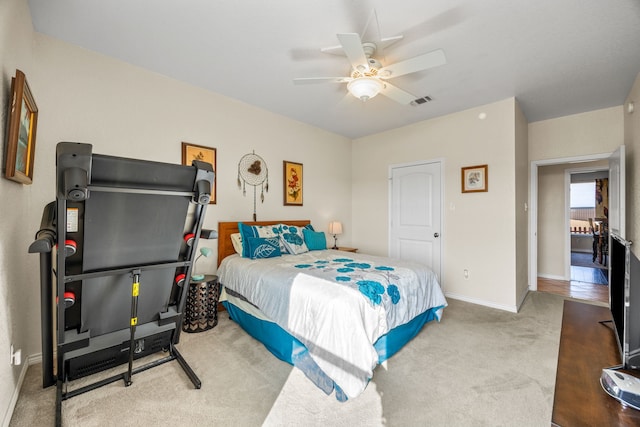 carpeted bedroom featuring ceiling fan