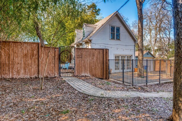 view of front of home with a garage and an outdoor structure