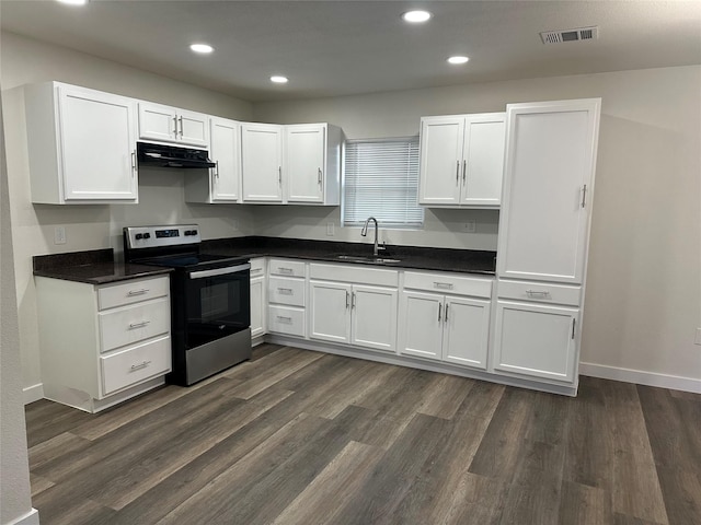 kitchen featuring stainless steel range with electric stovetop, dark hardwood / wood-style floors, sink, and white cabinets