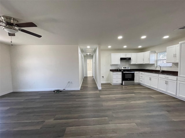 kitchen with white cabinets, sink, electric range, and dark hardwood / wood-style flooring