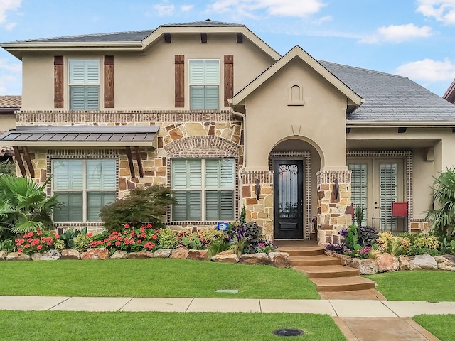 view of front of home with a front lawn