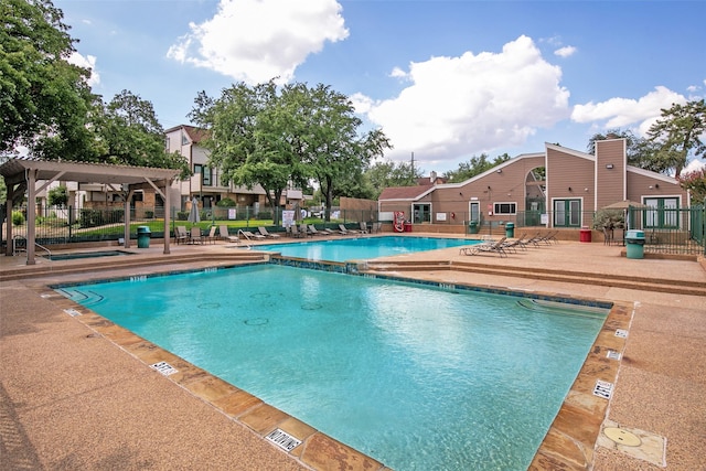 view of swimming pool with a pergola and a patio