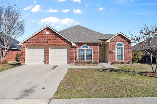 view of front of house featuring a garage and a front lawn