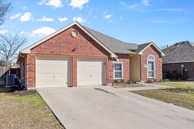 view of front of home with a garage, a front lawn, and central air condition unit