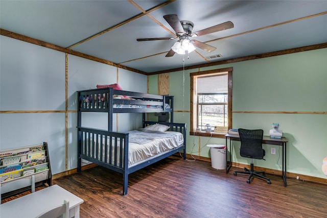 bedroom with dark hardwood / wood-style floors