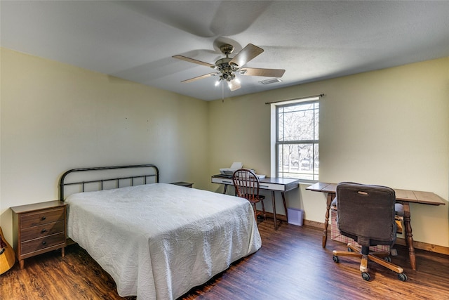 bedroom featuring dark hardwood / wood-style flooring and ceiling fan