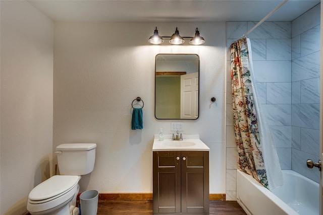 full bathroom with hardwood / wood-style flooring, vanity, shower / bath combination with curtain, and toilet