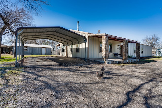 exterior space featuring a carport and covered porch