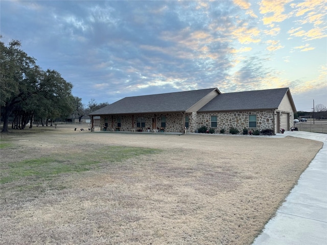 single story home with a garage