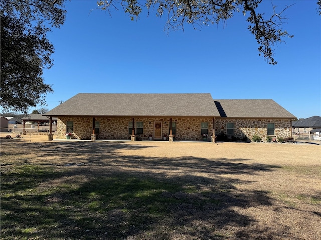 back of house with a lawn