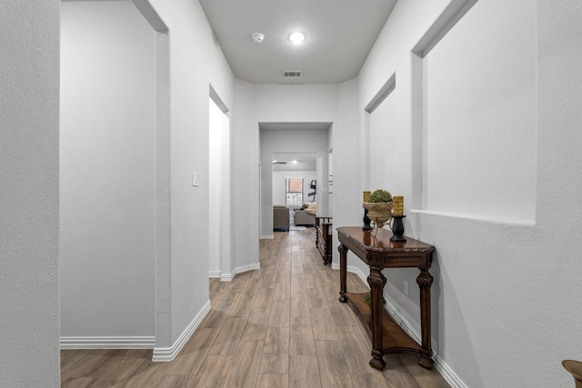 hallway featuring light hardwood / wood-style flooring