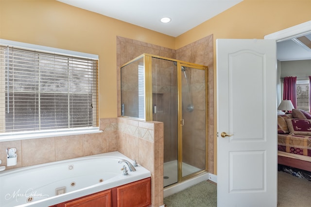 bathroom featuring separate shower and tub