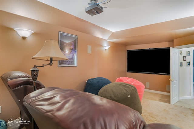 home theater with vaulted ceiling and light carpet