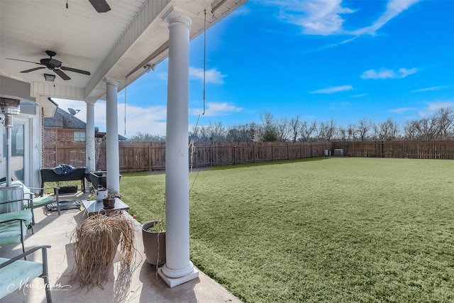 view of yard featuring a patio and ceiling fan