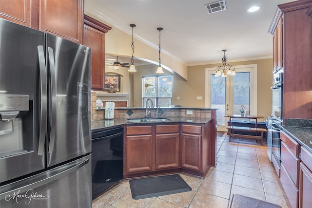 kitchen with decorative light fixtures, dishwasher, sink, stainless steel fridge, and ornamental molding