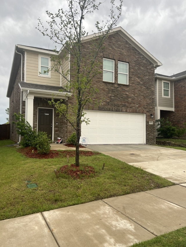 view of front facade featuring a garage and a front lawn