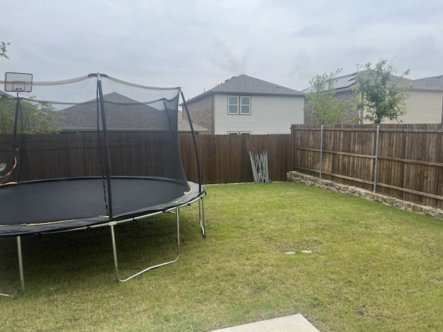 view of yard featuring a trampoline