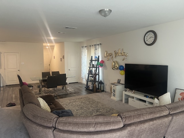 living room featuring dark hardwood / wood-style flooring