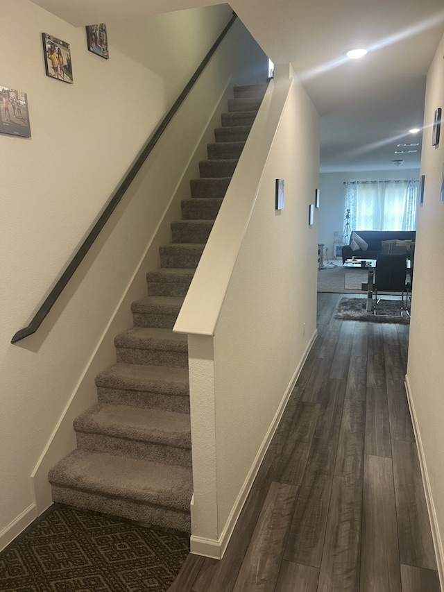 staircase featuring hardwood / wood-style flooring