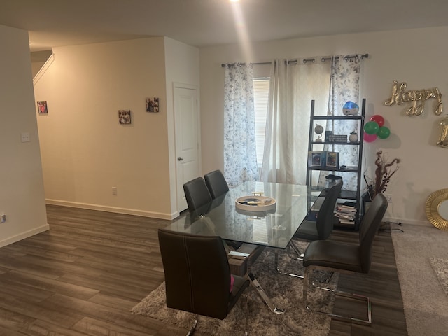 dining area featuring dark hardwood / wood-style flooring