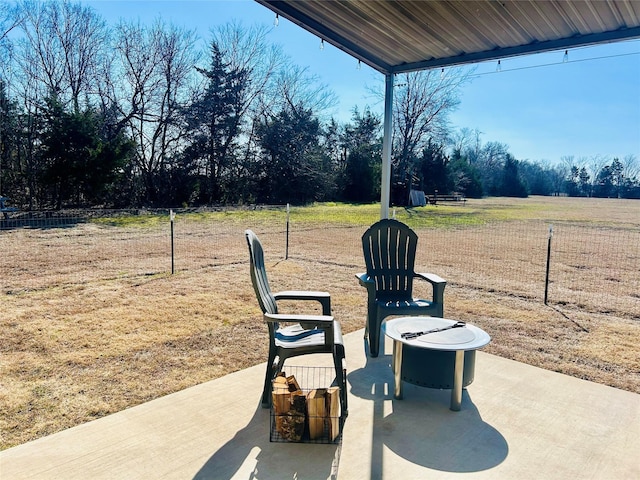 view of patio featuring fence