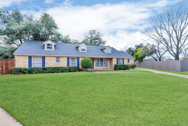 new england style home with a front lawn