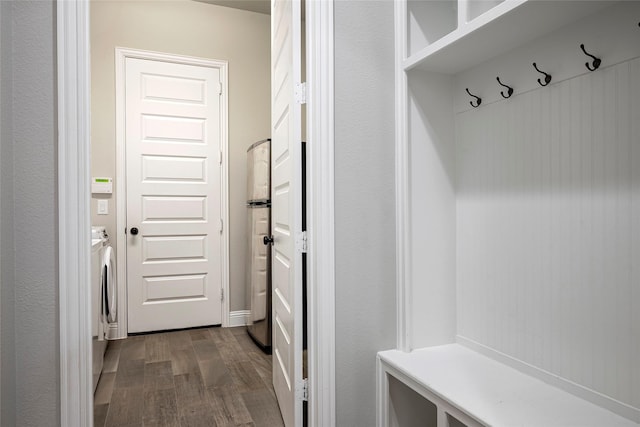 mudroom featuring separate washer and dryer and hardwood / wood-style floors