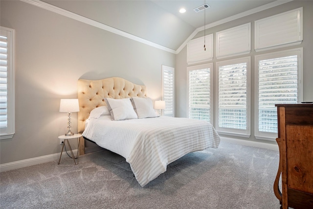 carpeted bedroom with lofted ceiling and crown molding