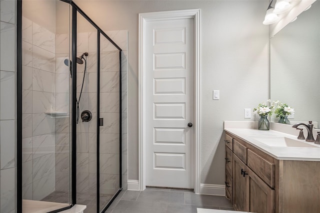 bathroom with vanity and a shower with door