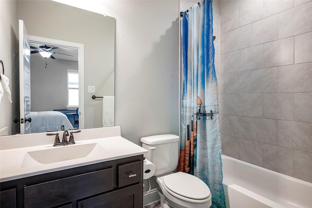 full bathroom with ceiling fan, vanity, toilet, and shower / tub combo