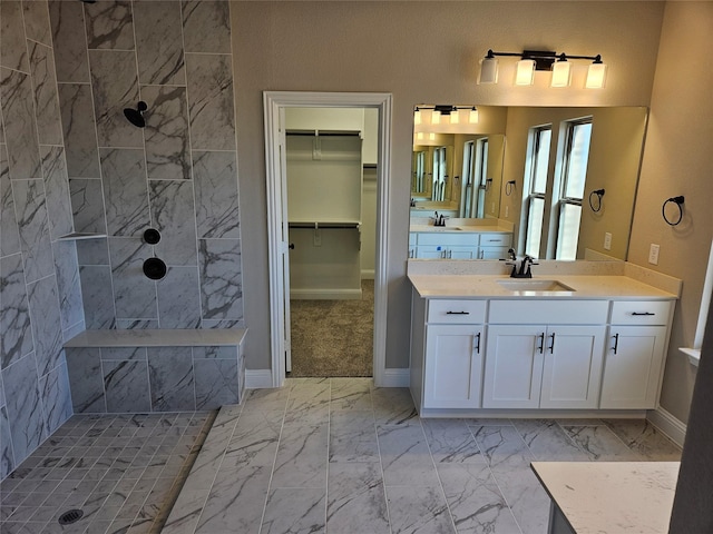 bathroom featuring vanity and a tile shower