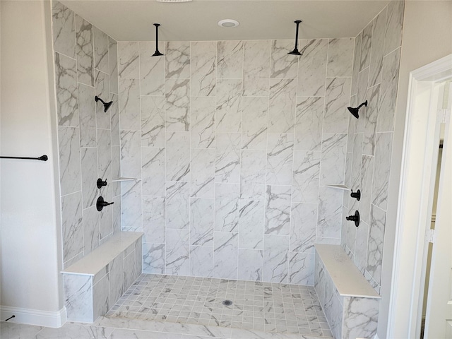 bathroom with a tile shower